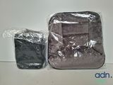 two pieces of luggage sitting on a table next to each other