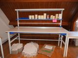 a white desk with a blue shelf on top of it