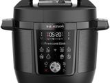 a close up of an electric pressure cooker on a white background