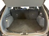 a trunk of a car with the back seats open