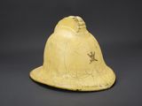 a yellow helmet with a bird on it sitting on top of a table