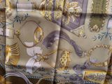 a close up of a scarf with a picture on it
