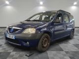 a picture of a small blue car parked in a garage