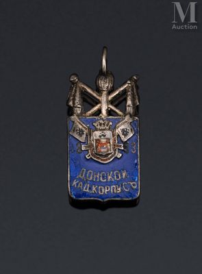 an image of a blue and silver pendant with a coat of arms on it