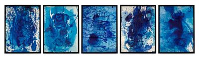 four blue abstract paintings hanging on a wall in a room
