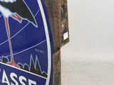 a blue sign with a white stork on it