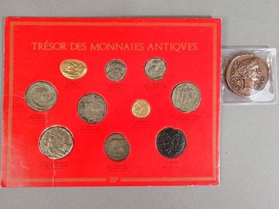 a close up of a red book with a bunch of coins on it