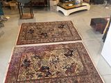 two rugs that are on the floor in a room