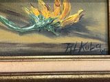 a painting of a yellow flower in a gold frame