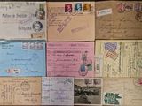 many different types of old postcards on the table