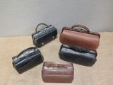 several pieces of luggage sitting on top of a table next to each other