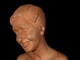 a statue of a man with a smile on his face