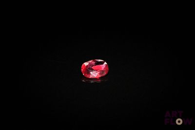 a red diamond on a black background