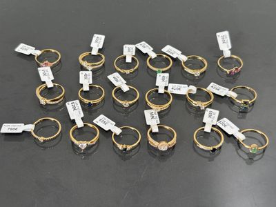 a lot of rings with tags on them on a table