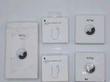four white boxes with ear buds and earplugs on them