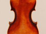 an old violin with a wooden back and a long neck