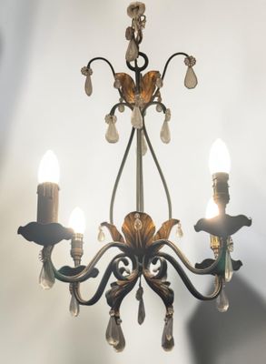 a small chandelier with three lights hanging from it