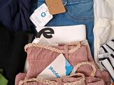 a pile of clothing that is sitting on the floor