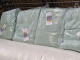 a lot of pillows on the couch in the store