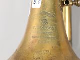 a brass bell that is sitting on a table