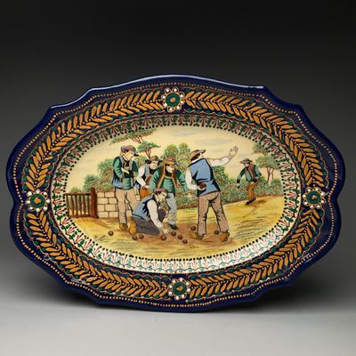 an image of a decorative plate with a painting of a group of men