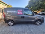 a grey van parked in front of a building
