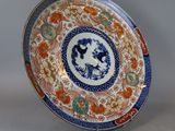 an image of a decorative plate with a woman on it