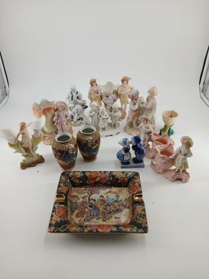 a lot of figurines that are sitting on a table