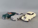three toy cars that are sitting next to each other