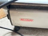 a close up of a delcoupe machine on the ground