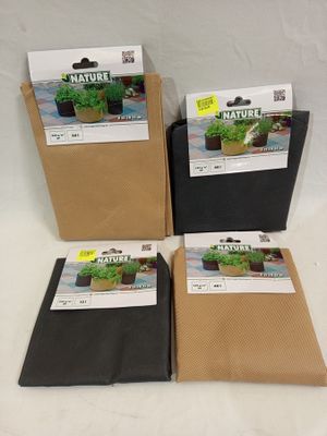 a group of three bags of plants sitting on top of a table