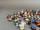 a lot of small figurines that are on a table
