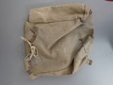 a bag that is sitting on a table with a pair of scissors