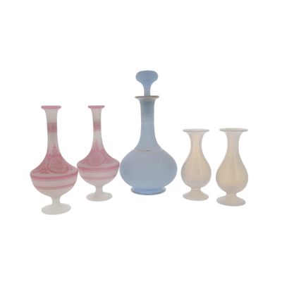 four vases sitting next to each other on a white surface