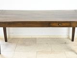 a wooden table with a drawer on top of it