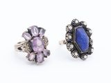 a pair of silver rings with a blue stone and amethorate