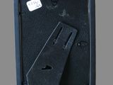 a close up of a black box with a piece of paper sticking out of it