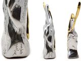 three different views of a pair of high heeled shoes