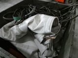 a box with a bunch of wires and a gas mask in it