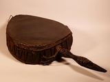 a small wooden drum with a handle on a white background