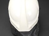a close up of a white hard hat on a black background