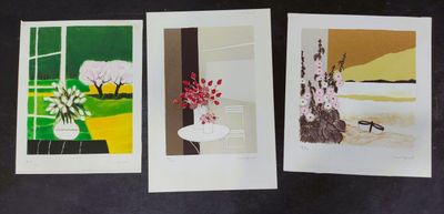 three cards with paintings of trees and flowers on them on a black surface