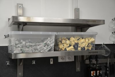 a metal shelf that has a bunch of food in it
