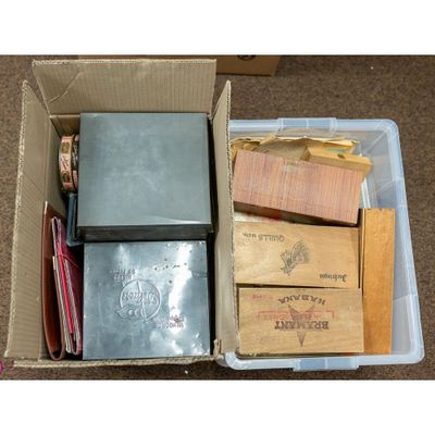 a box full of books and papers sitting on the floor