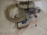 a box of wires and wires sitting on a bed
