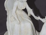 a statue of a woman holding a child ' s hand