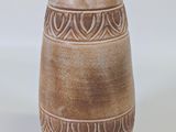 two vases sitting next to each other on a white surface