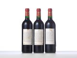 three bottles of wine sitting on top of a table