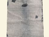 an image of a gray bag with holes on it on a white background