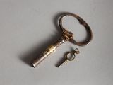 an old key that is laying on a table